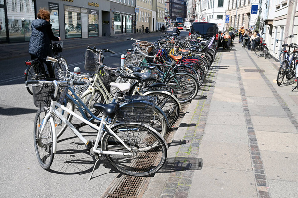 Bicycle parking in a street in Copenhagen  - Fotoğraf, Görsel