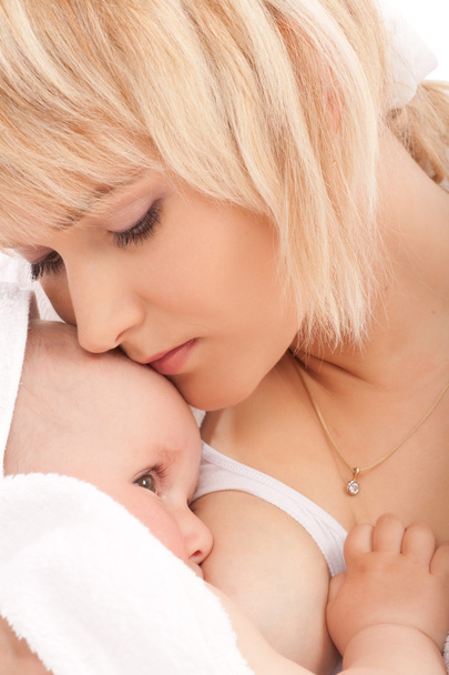 Mother breast feeding her newborn baby girl - Foto, immagini