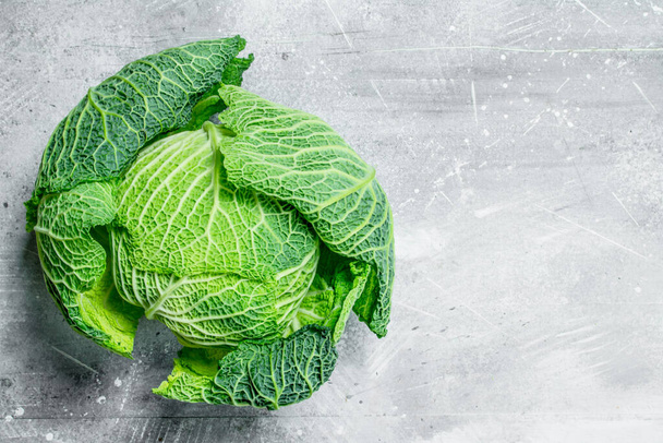 Savoy cabbage . On rustic background - Photo, image