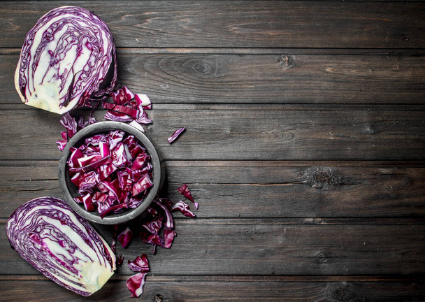 Cabbage salad in the bowl. On a wooden background. - Foto, immagini