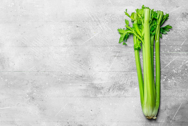 Fresh, healthy celery. On white rustic background - Foto, Imagen
