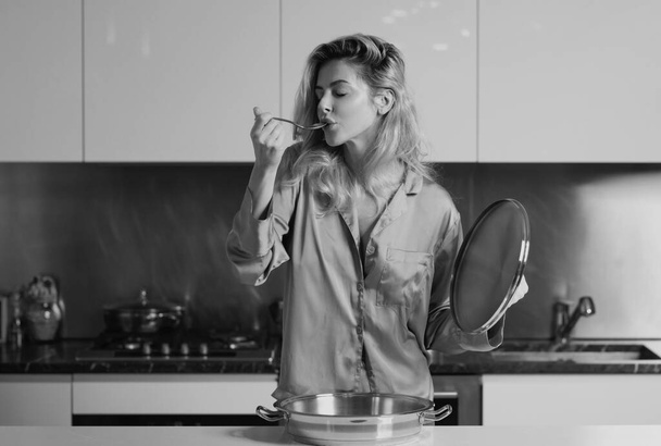 Girl with cooking pot, doing housework. Housekeeping concept. Young woman cooking breakfast. Sexy slim woman at home in morning. Taste and delicious - Φωτογραφία, εικόνα