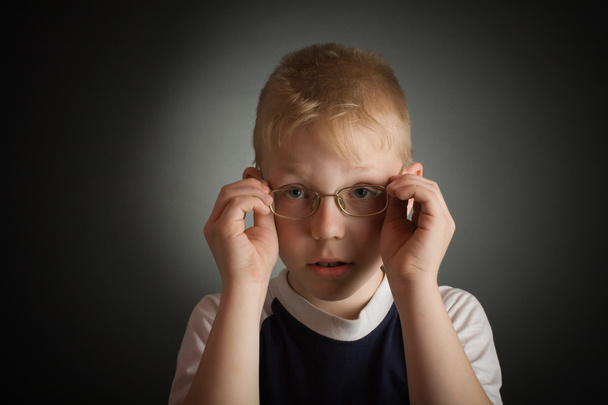 Boy try on a glasses - Фото, изображение