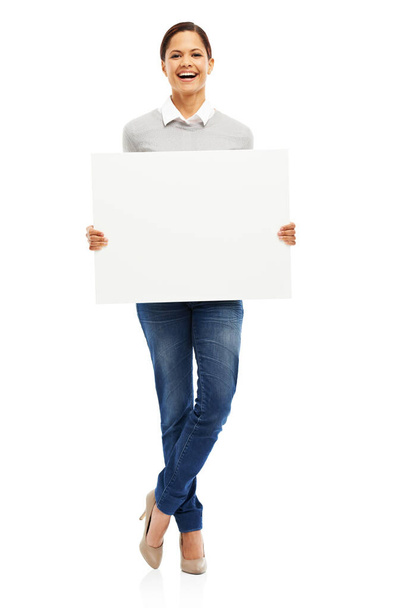 Shes got this. Studio portrait of an attractive young woman holding a blank placard isolated on white - 写真・画像
