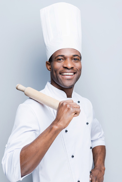 African chef  carrying rolling pin - Fotografie, Obrázek