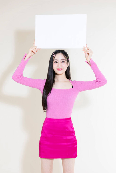 vintage y2k pink retro concept photo of korean asian cute woman holding a frame - 写真・画像