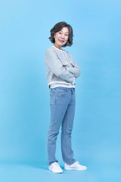happy active young senior Korean Asian woman standing - Foto, imagen
