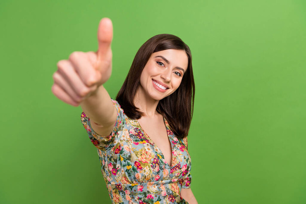 Photo of young friendly woman wear blouse thumb up recommendation promo good job excellent fine result isolated on green color background. - Fotó, kép