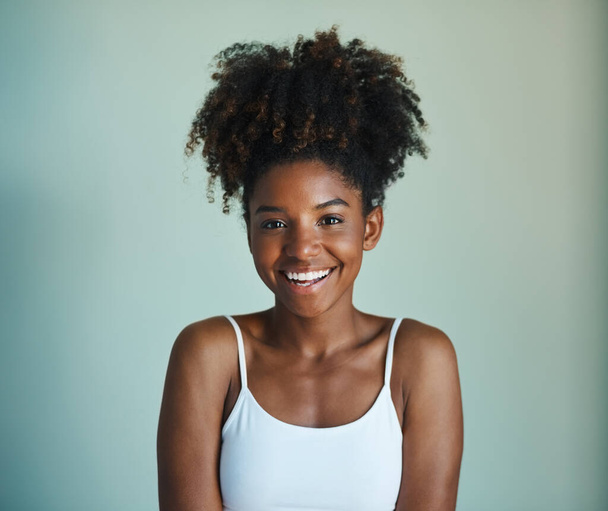 Smile, youth and portrait of black woman on studio background with afro, happiness and skincare. Beauty, dermatology and happy African girl, model with mockup, natural cosmetics and beautiful face - Foto, Imagem