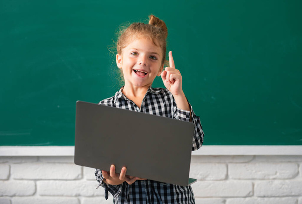 School girl studying math during online lesson in classroom, online education - Фото, зображення