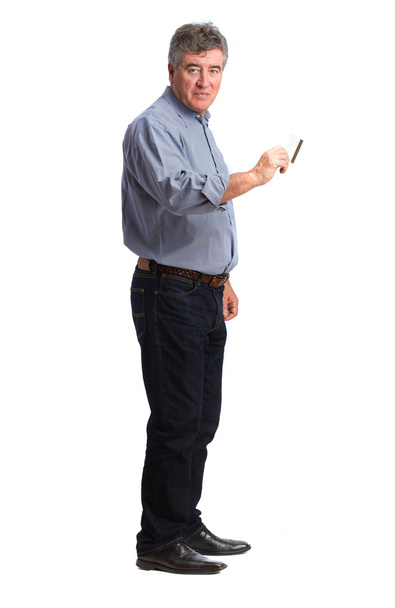 Satisfied man holding a credit card - Фото, изображение