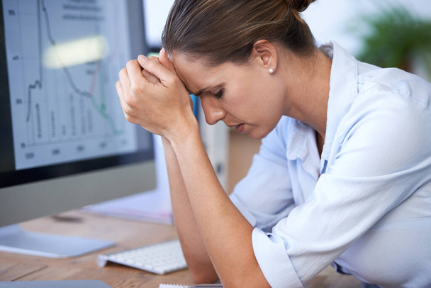 Business woman, computer and stress for bankruptcy risk, stock market crash or financial crisis. Worried female worker with anxiety, debt and headache for poor economy, problem and depression at desk. - Photo, Image