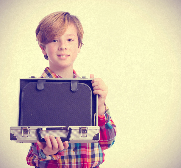 Happy boy holding a briefcase - Valokuva, kuva