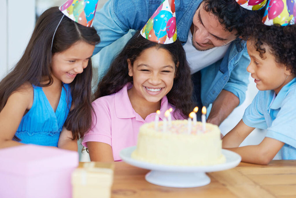 Birthday party cake, father and happy kids celebrate special event with friends, family and surprise dessert food. Fun celebration, congratulations and children excited for youth growth of young girl. - Zdjęcie, obraz