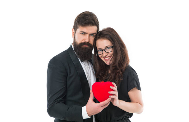 Love language. elegant couple formal event. love and romance. romantic date for man and woman. happy valentines day. tuxedo man beard and girl in glasses. formal couple in love hold heart. engagement. - Foto, afbeelding