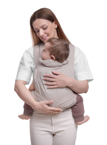 Mother holding her child in sling (baby carrier) on white background - Foto, Imagem