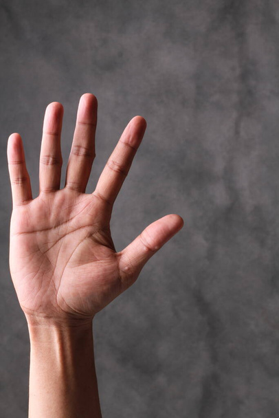 a man's hand is showing a gesture - Foto, Imagem