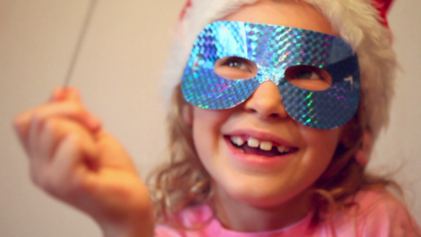 Little girl in holiday mask - Footage, Video