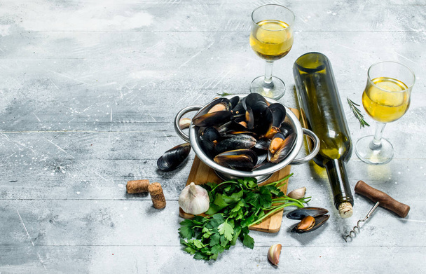 Fresh seafood clams with parsley and white wine. On a rustic background. - Photo, Image