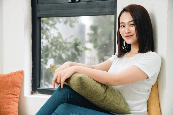 Image of young Asian woman at home - Foto, imagen