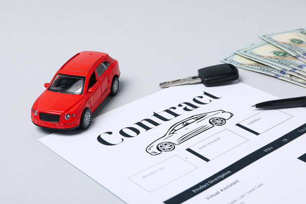Concept of car purchase and insurance with toy car - Photo, Image