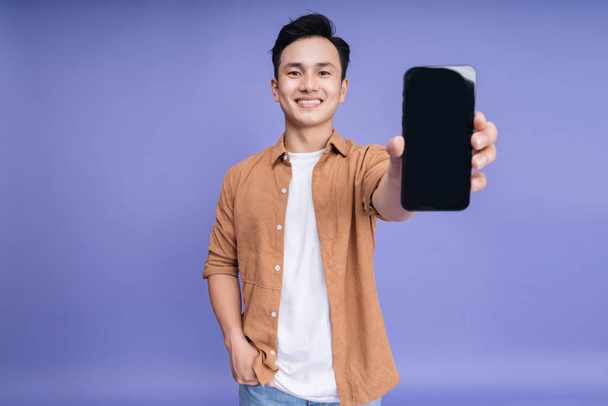 Photo of young Asian man on background - Foto, immagini