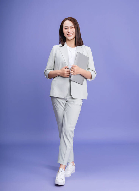 Photo of young Asian businesswoman on background - Zdjęcie, obraz