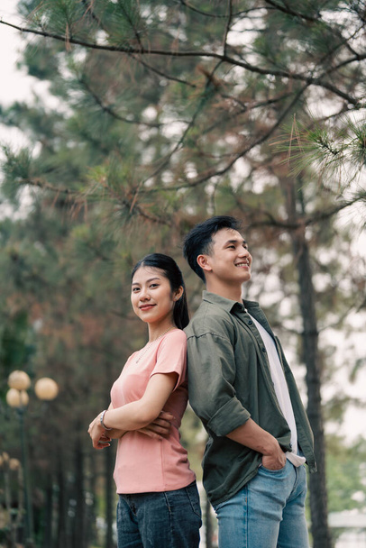 Portrait of young Asian couple outside - Photo, Image