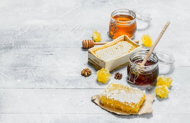 The range of types of natural honey. On a rustic background. - Photo, Image