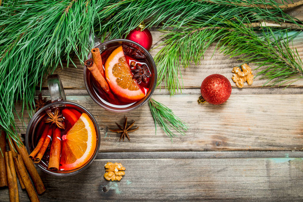Christmas hot mulled wine. On a wooden background. - Фото, зображення