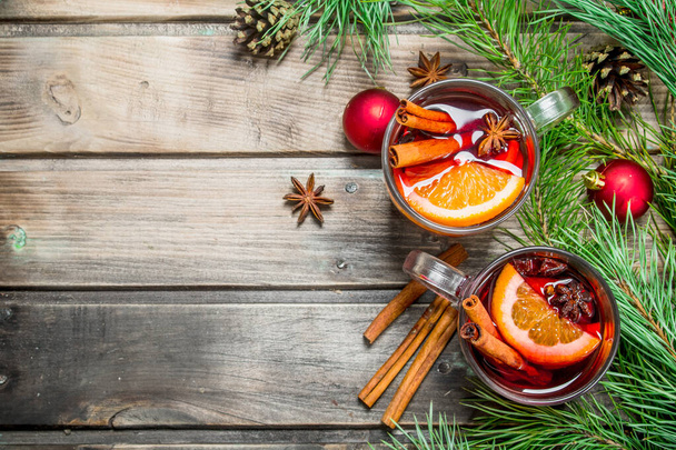 Christmas hot mulled wine. On a wooden background. - Photo, Image