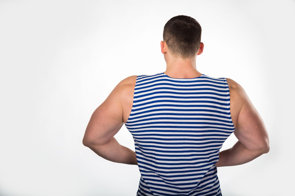 Muscular man in a striped vest - Photo, Image