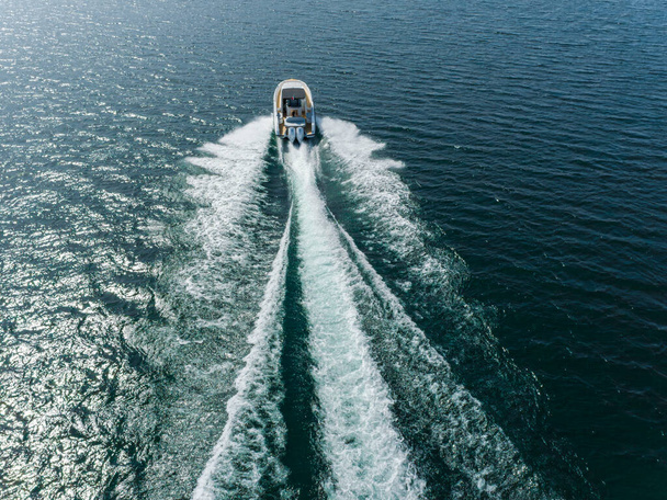 motor yacht in navigation, aerial view - Foto, Imagen