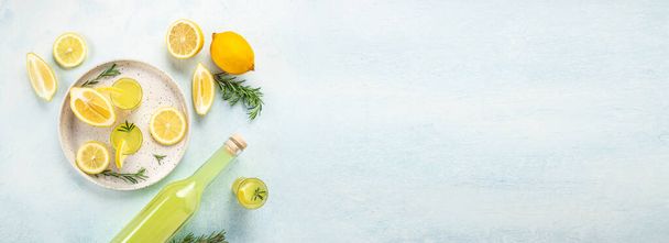 limoncello. traditional strong alcoholic drink and lemons. Long banner format. top view. - Фото, изображение