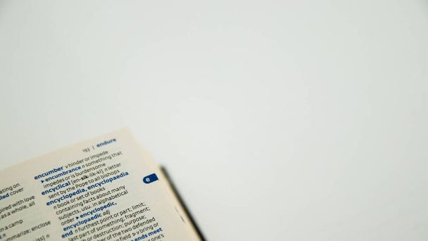 close up of a book with a pen - Фото, изображение