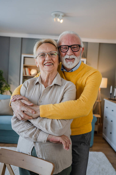 Portrait of senior husband and wife happy caucasian man and woman old couple at home - Photo, Image