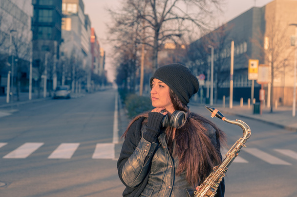 Beautiful young woman with her saxophone - Φωτογραφία, εικόνα