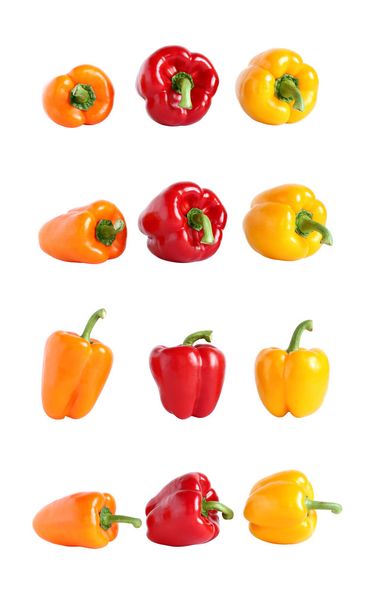 Orange, red and yellow sweet paprika isolated on white - Фото, изображение