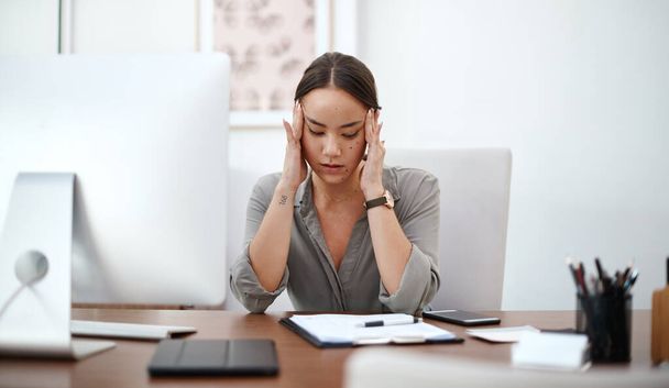 Migraine, headache and business woman in office with online career burnout, mental health risk and mistake. Brain fog, problem or pain of asian person or employee massage temple, fatigue and stress. - Fotografie, Obrázek