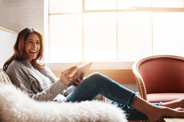 Smile, tablet and credit card with a woman online shopping on a sofa in the living room of her home. Ecommerce, finance and fintech banking with a happy young female online customer in her house. - Fotoğraf, Görsel