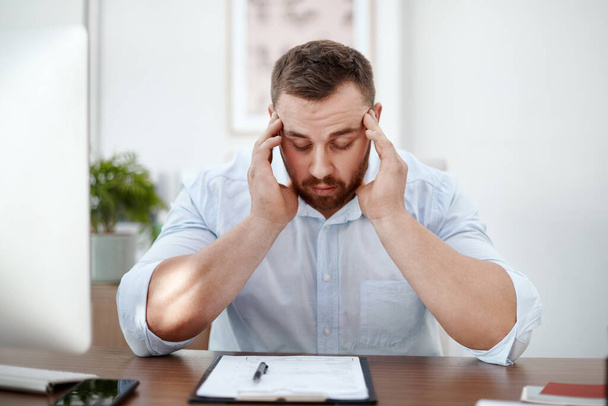 Documents, headache and business man in office with career burnout, mental health risk and paperwork. Brain fog, problem or pain of tired person or employee with fatigue and stress for writing notes. - Photo, Image