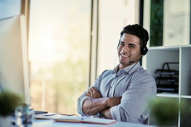 Help desk agent, smile and portrait of man with advice, confidence and happiness at at customer service agency. Happy phone call, conversation and callcenter consultant with headset in modern office - Foto, afbeelding