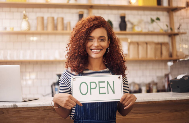 Portrait, woman and smile with open sign in cafe, shop and store for retail trading time, board and advertisement. Happy restaurant owner opening small business with signage, information and welcome. - Zdjęcie, obraz