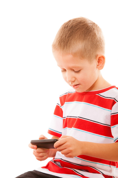 Little boy playing on smartphone - 写真・画像