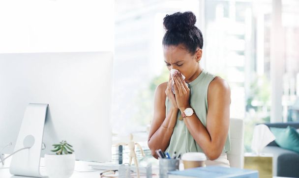 Sick, allergy and blowing nose with business woman in office for illness, virus and hay fever. Sneeze, allergies and tissue with female employee at desk for cold, disease and influenza infection. - Photo, image