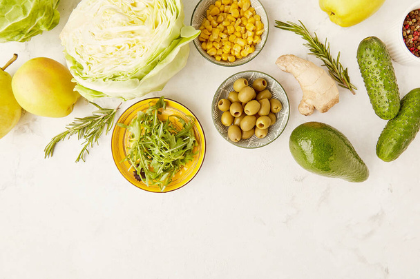 Low fodmap vegan ingredients vegetables, fruits, greens. Fodmap diet concept with copy space. Flat lay. Yellow and green colours. - Photo, Image