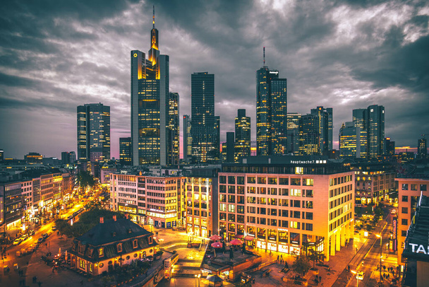 A view over the city of Frankfurt, with its streets and the skyline. Nice architecture and lots of skyscrapers. - Fotó, kép