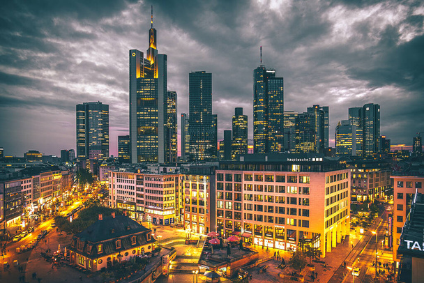A view over the city of Frankfurt, with its streets and the skyline. Nice architecture and lots of skyscrapers. - Фото, изображение