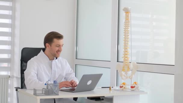 A vertebrologist works in his office. Spine disease concept. - Footage, Video