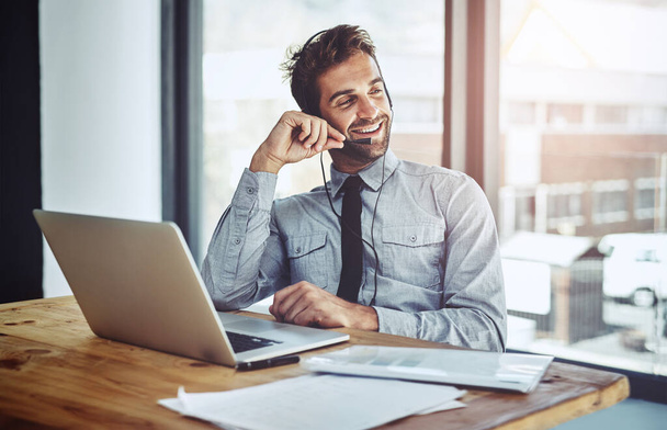 Happy businessman, laptop and call center headphones for customer service or financial advice at office. Friendly man person or consultant agent talking on headset in online consulting at workplace. - Φωτογραφία, εικόνα